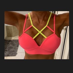 Strappy sports bra pink and yellow.
